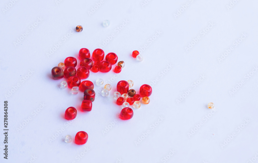 close up of red and white beads isolated close up of red and white beads isolated