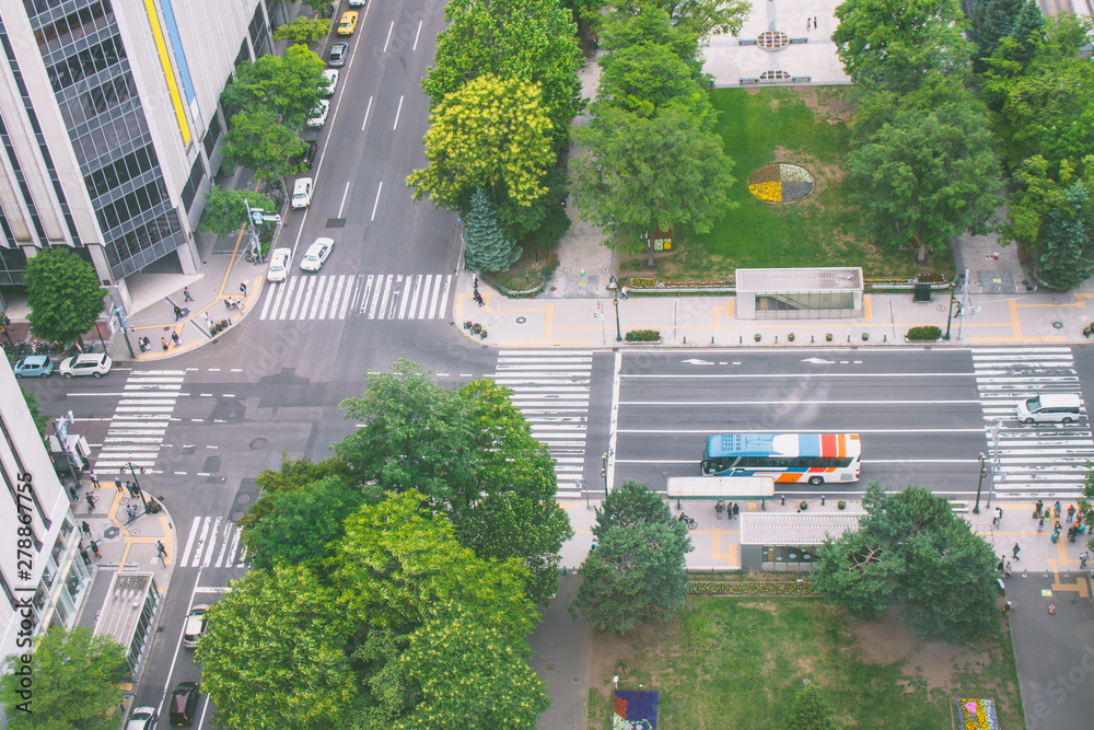 Aerial view from Sapporo TV Tower of street road and intersection in Sapporo City nearly Odori Park. (Selective focus)