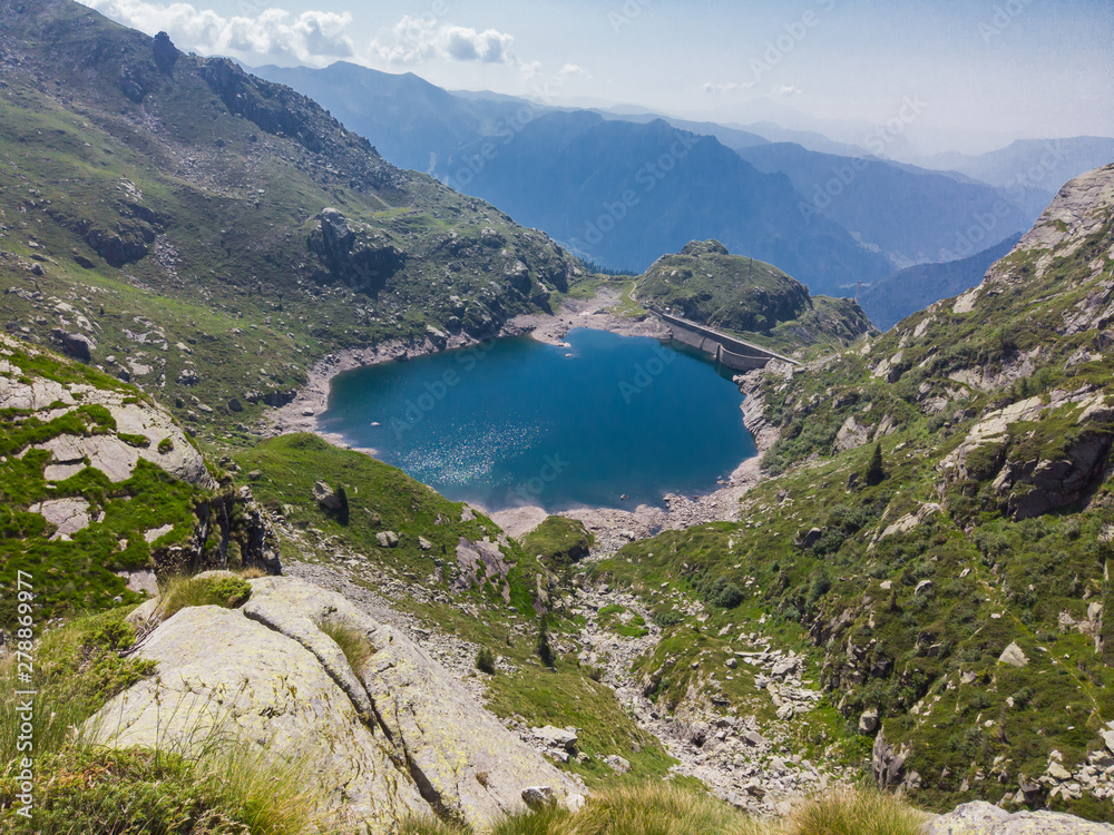 Italian Alps. Italy. Wonderful view of the an alpine lake created by the dam barrier. Orobie. Valgoglio lakes