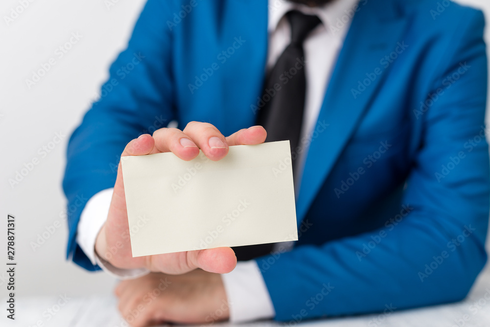 Man holds empty paper with copy space in front of him. White space for advertising message. Man holds empty paper with copy space in front of him. White space for advertising message.