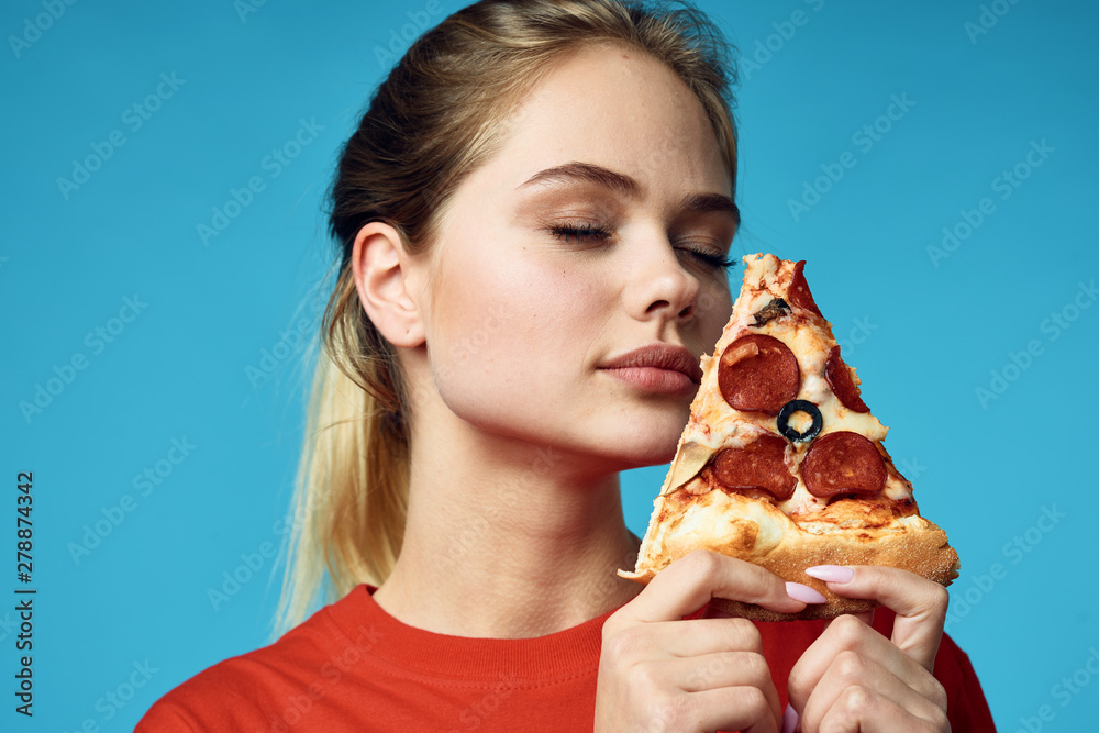 woman eating pizza