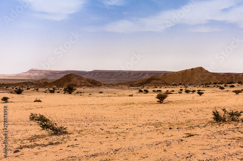 A desert landscape south-west of Riyadh  A combination of plain and rocky hill terrain typical for Riyadh Province