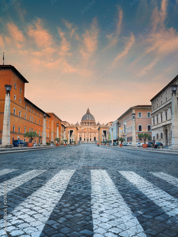 view through pedestrian to sunrise clouds above Vatican in Rome in Italy