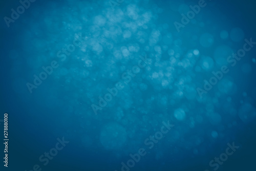 Blue bokeh abstract texture. Blurred bright light at night.