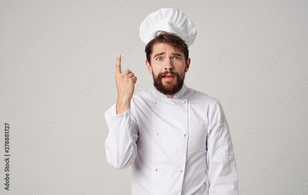 Male cook gesticulating with a hand Male cook gesticulating with a hand