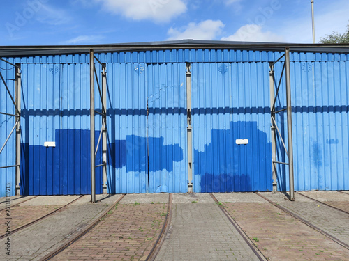 blue painted metal doors ofan old shack or barn photo