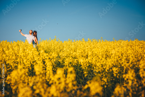 Selfie in yellow spring field