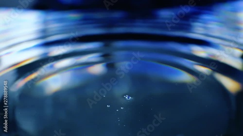 Water drop falling down. Slow motion