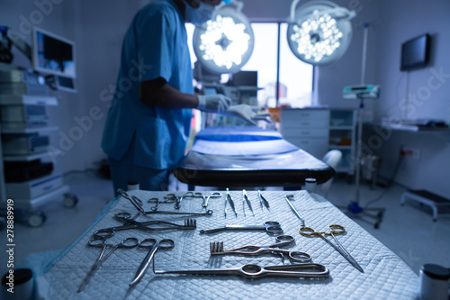 Foto Surgical instruments arranged on table in operating room of hospital
