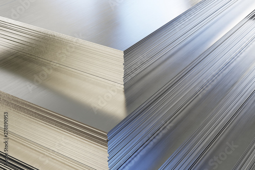 Steel or aluminum sheets in warehouse, rolled metal product.