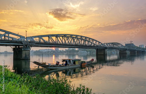 Dawn at Trang Tien Bridge. This is a Gothic architectural bridge spanning the Perfume river from the 18th century designed by Gustave Eiffel in Hue, Vietnam © huythoai