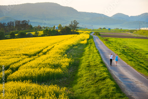 Couple in spring nature  man and woman together on the road