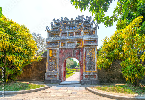 Colorful imperial city gate. This is lead into the forbidden city where the feudal king work Imperial Royal was in the 19th century in Hue, Vietnam