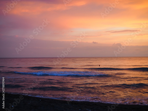picturesque Pink sunset on lake beach sea sand beautiful colors in the sky clouds © Yulia