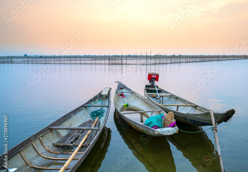 Fototapeta Naklejka Na Ścianę i Meble -  Wooden boat dock in Chuon lagoon, Hue, Vietnam. This is a living means of transportation in the flooded area in central Vietnam