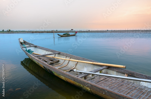 Fototapeta Naklejka Na Ścianę i Meble -  Wooden boat dock in Chuon lagoon, Hue, Vietnam. This is a living means of transportation in the flooded area in central Vietnam