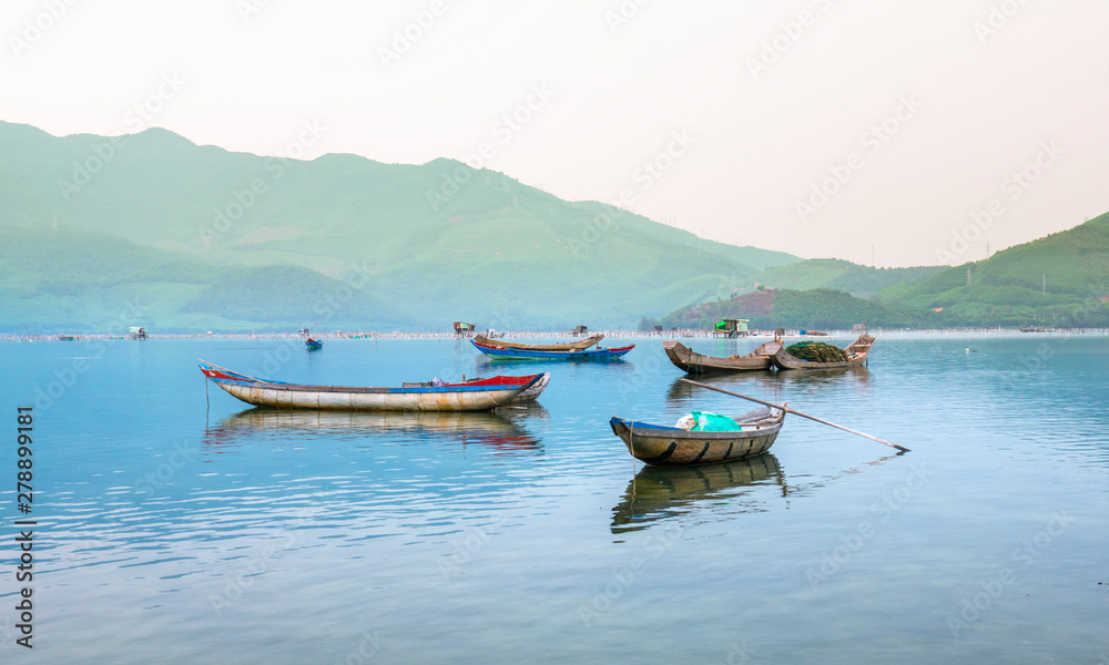 Fototapeta premium Fishing wharf in Lap An lagoon, Hue, Vietnam. This is a living means of transportation in the flooded area in central Vietnam