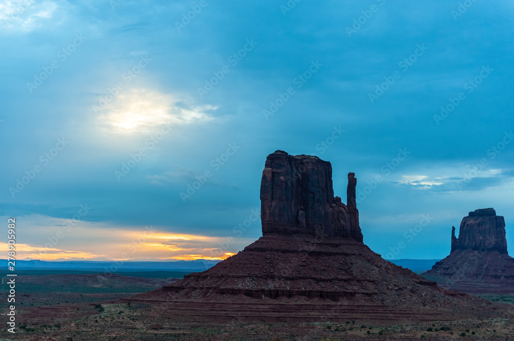 Sunrise over the famous mitten and merrick buttes of Monument Valley