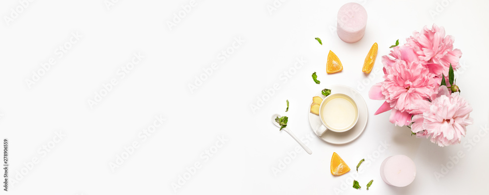 Composition with cup of tea, peone flowers, fresh orange, mint and sugar on a gray background. Flat lay, top view. - obrazy, fototapety, plakaty 