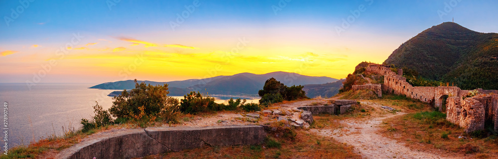 Sunset on the Adriatic sea coastline, view from ancient ruin of Mogren fortress on the high altitude, Montenegro