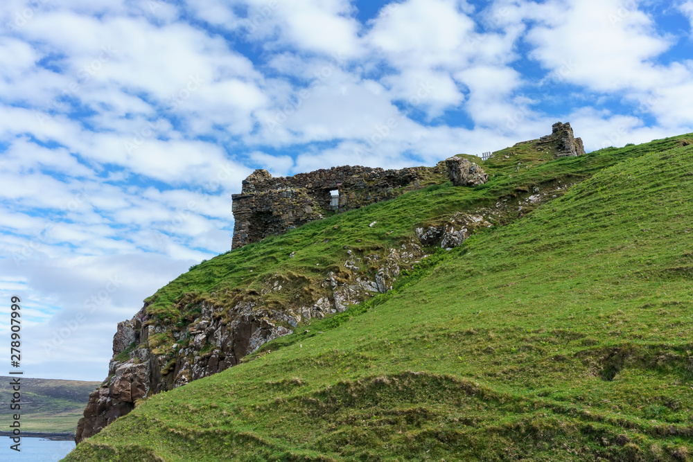 Duntulm Castle , the ruined castle on the north coast of Trotternish on the Isle of Skye in summer , Scotland