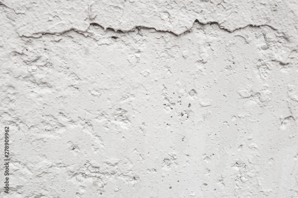 Obraz premium abstract background of a shabby old wall painted in white close up