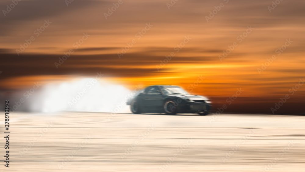 Car drifting, Blurred of image diffusion race drift car with lots of smoke  from burning tires on speed track Stock Photo