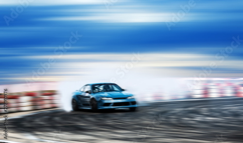 Car drifting, Blurred of image diffusion race drift car with lots of smoke from burning tires on speed track © applezoomzoom