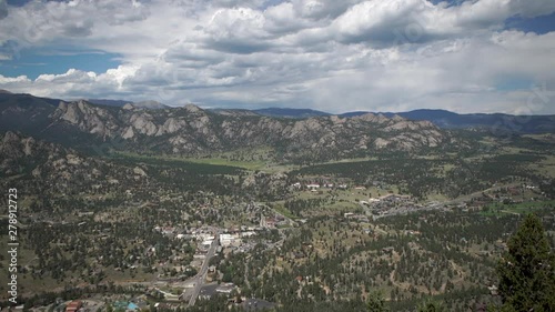 Pan of small tourist mountain town in Colorado from high above. photo