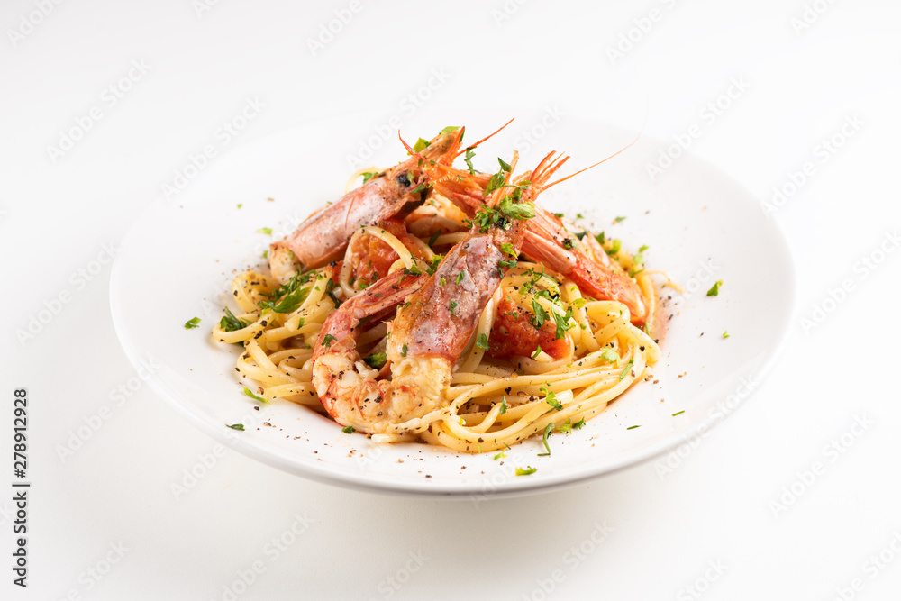 Linguine with garlic and king prawns on a plate