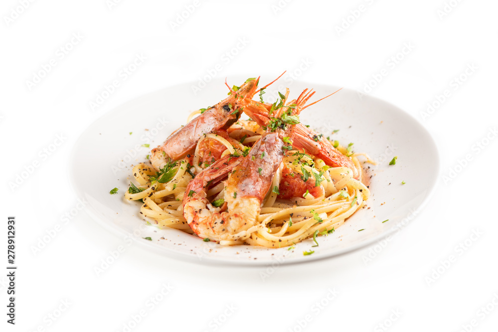 Linguine with garlic and king prawns on a plate