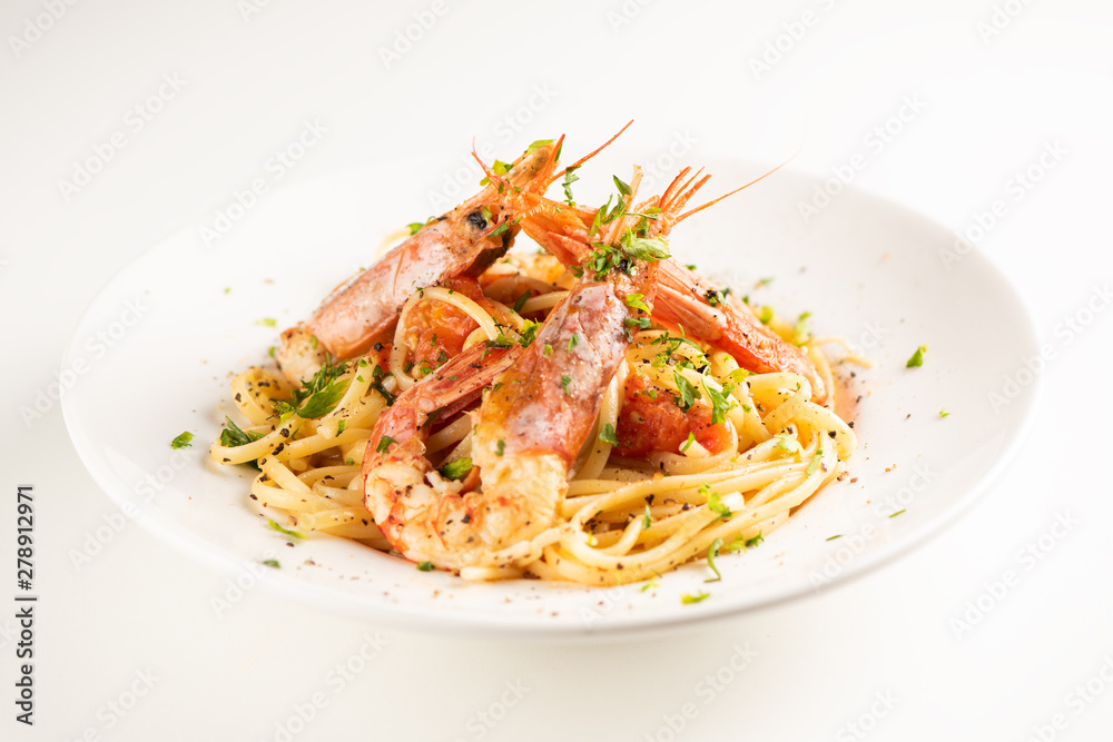 Linguine with garlic and king prawns on a plate Linguine with garlic and king prawns on a plate