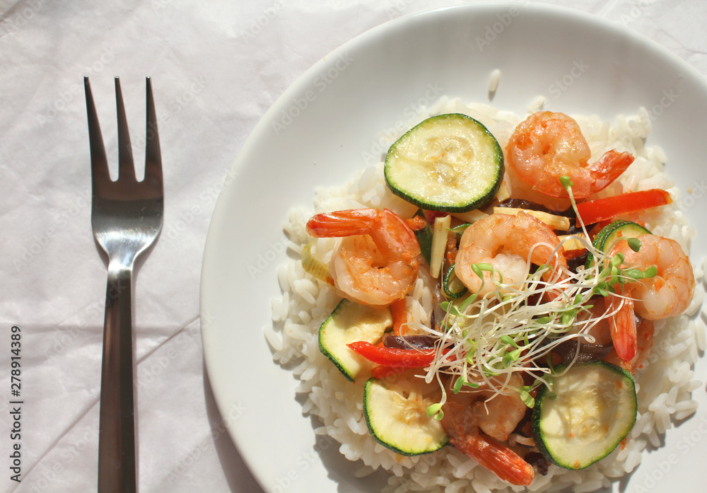 Sauteed shrimps with vegetables and rice. Sauteed shrimps with vegetables and rice.