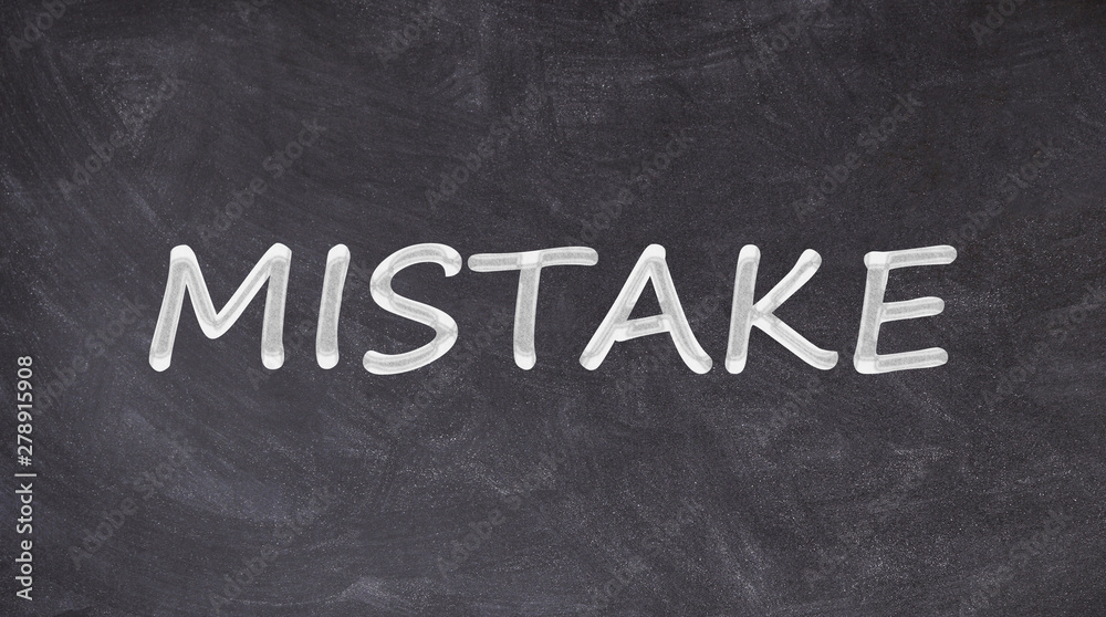 Fototapeta premium Mistake text written on blackboard