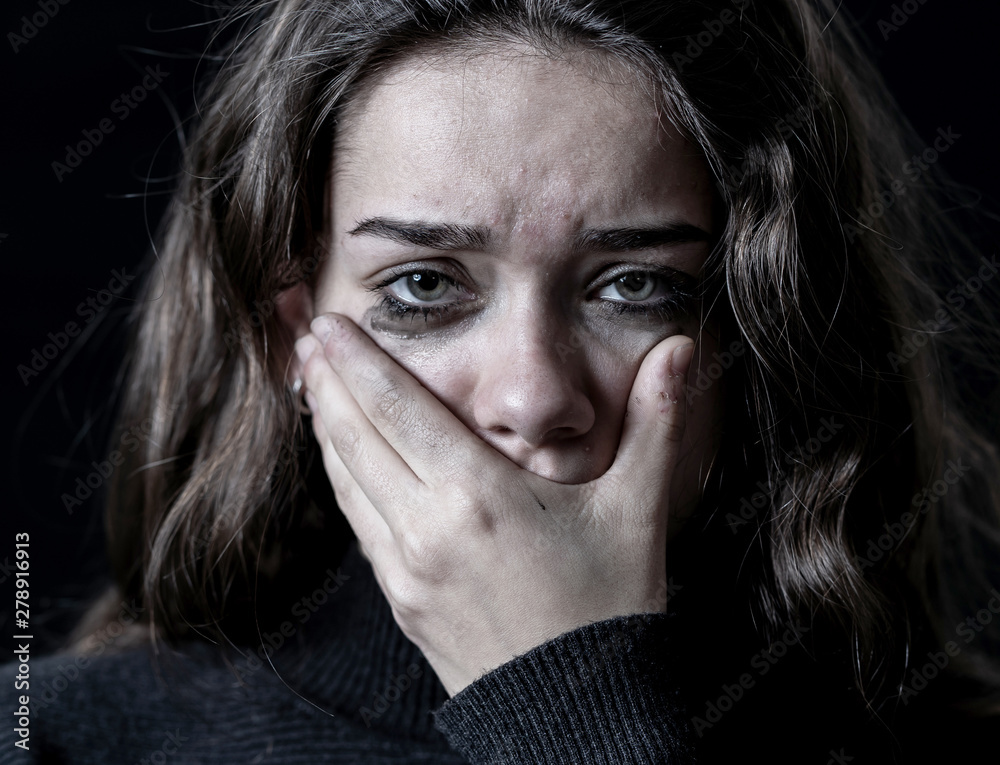Portrait of young sad frightened girl suffering from bullying, c Portrait of young sad frightened girl suffering from bullying, c