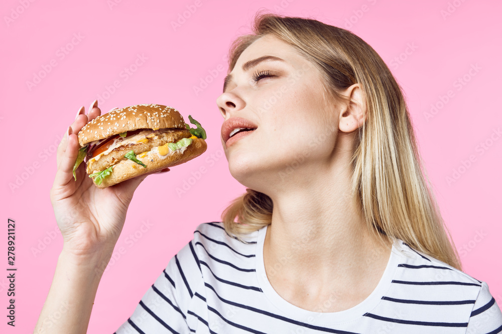 young woman with hamburger