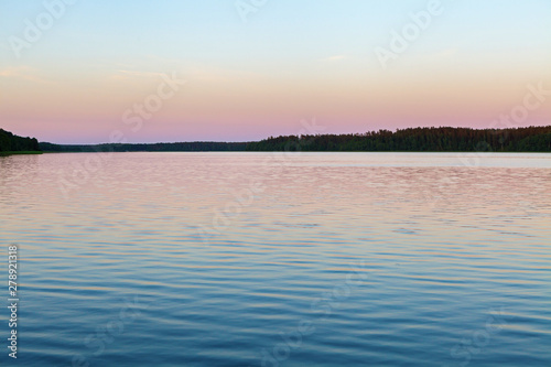 Vanilla sky over calm lake