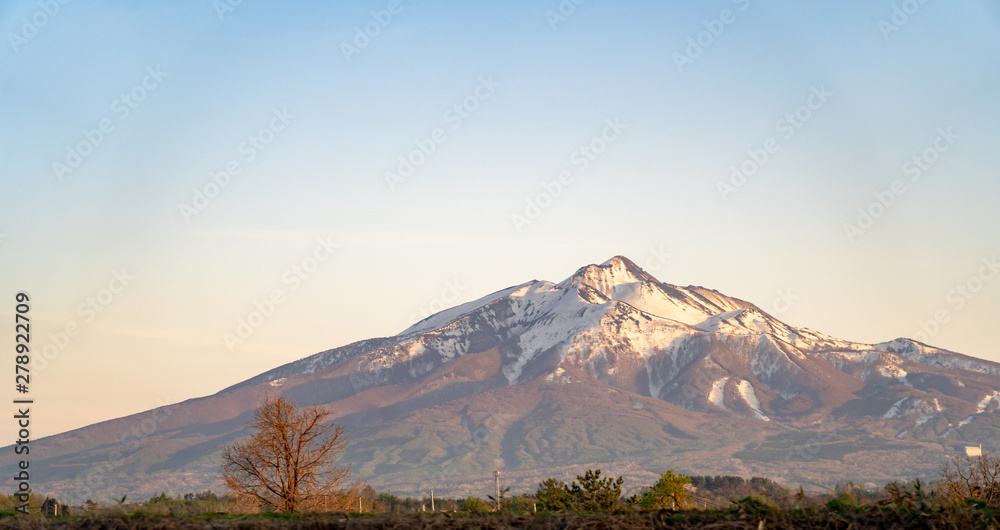Mount Iwaki on sun set time, a stratovolcano located in western Aomori Prefecture, Tohoku, Japan. It is also referred to as Tsugaru-Fuji due to its shape.