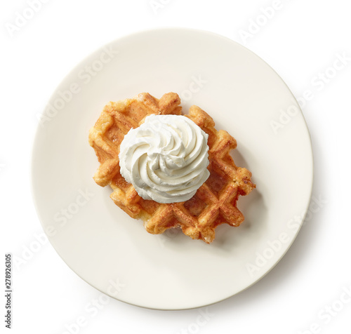 freshly baked belgian waffle on white plate