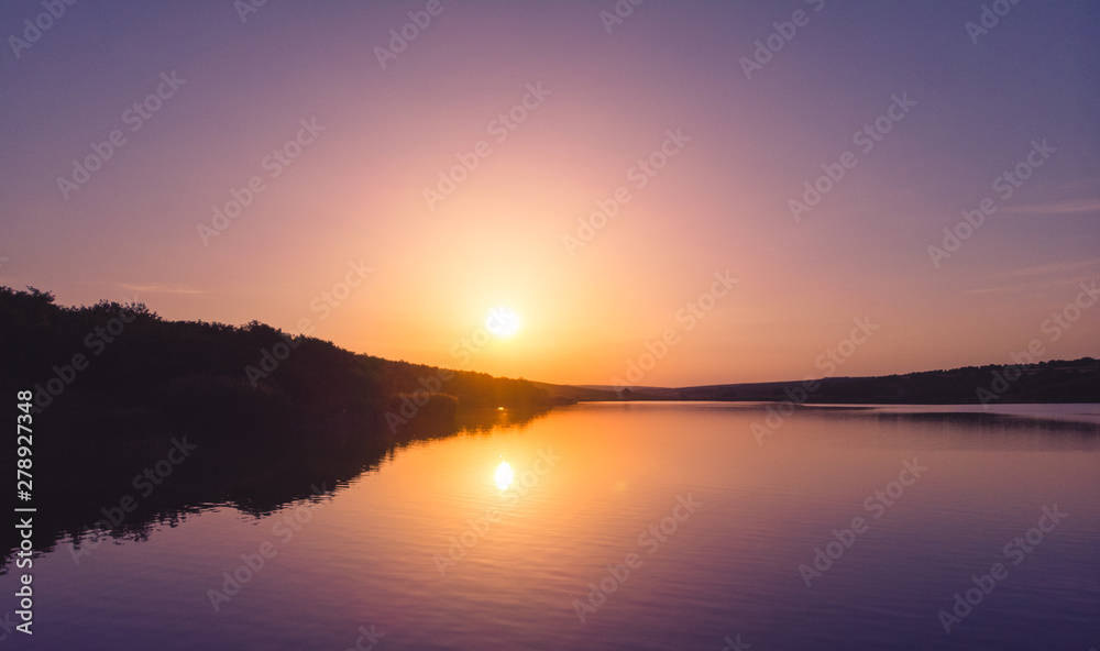 Sunset on the edge of a lake in the country, Moldova, 2019