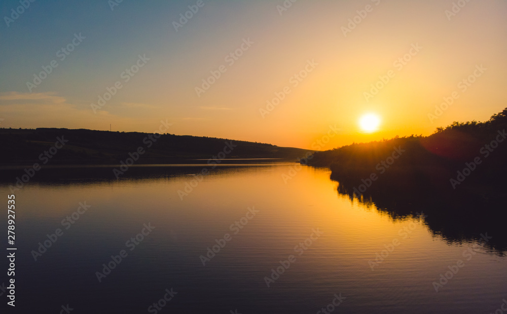 Sunset on the edge of a lake in the country, Moldova, 2019