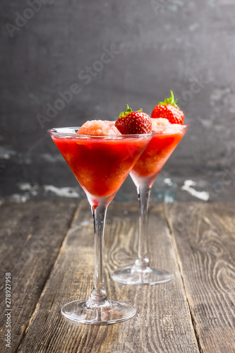 Frozen strawberry cocktail in martini glass. Selective focus.
