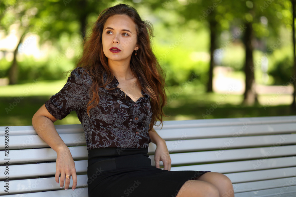Portrait of a beautiful girl on a Park bench Portrait of a beautiful girl on a Park bench