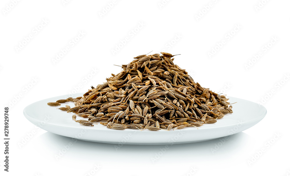caraway seeds in white plate on white background caraway seeds in white plate on white background