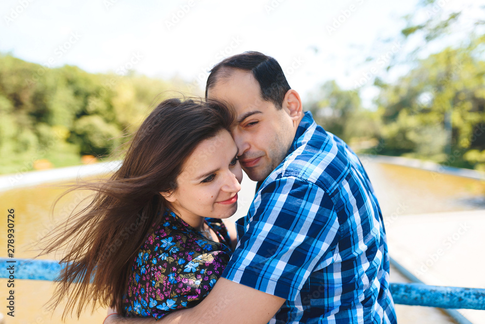 Fototapeta premium man hugging woman in wind