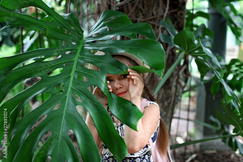 Kid in tropical garden