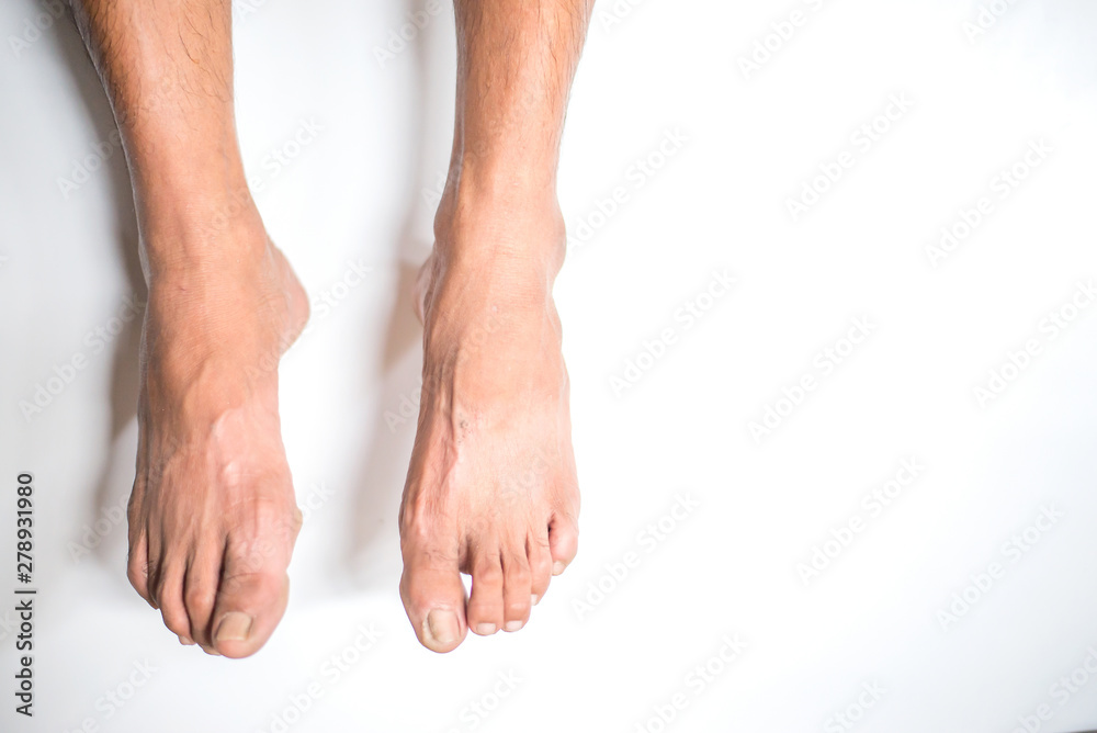 Man's feet hanging on the white background Stock Photo | Adobe Stock