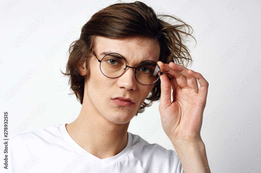 portrait of young man with glasses