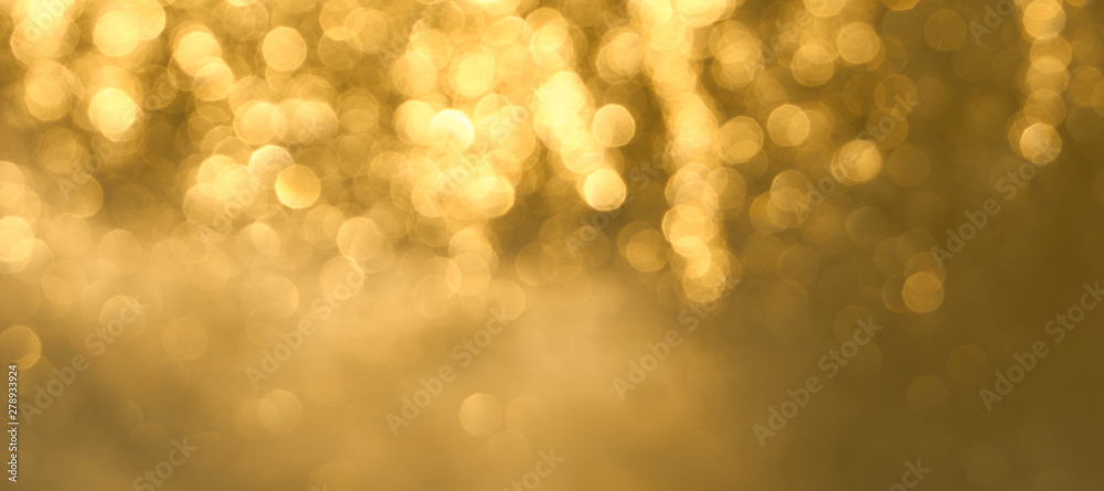 Golden bokeh background close up. Abstract blurred glowing background. - obrazy, fototapety, plakaty 