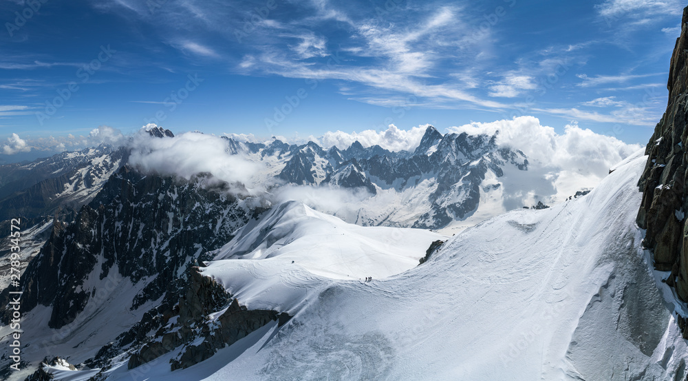 Obraz premium Panorama view of the Alps at summer seen from Aiguille Du Midi in Chamonix, France